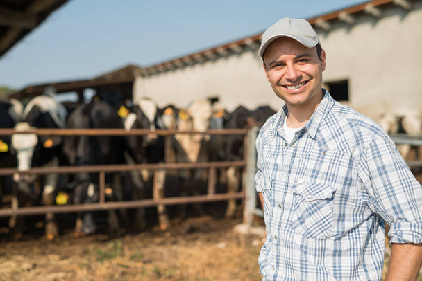 breeder in front of his cows - Photo, image