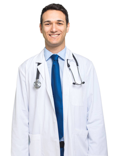 male doctor standing and smiling  - 写真・画像