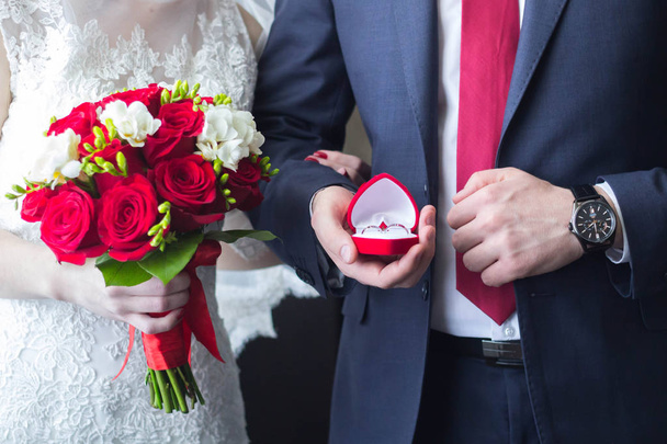 wedding bouquet, wedding rings, hands and mens watch closeup - Fotó, kép