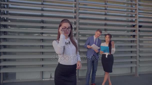 Confident Business Woman Took Break From Work, Smiling and Posing at Camera on Background of Colleagues Near Business Center in Neutral Colors. - Footage, Video