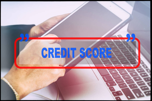 Hand and text  "CREDIT SCORE" with vintage background. Technology concept. - Zdjęcie, obraz