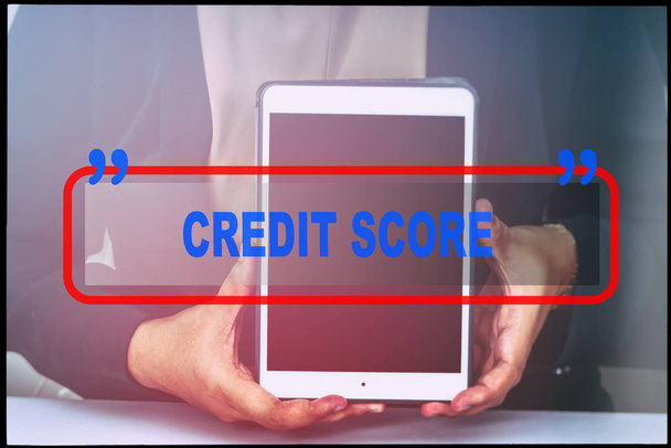 Hand and text  "CREDIT SCORE" with vintage background. Technology concept. - Photo, Image