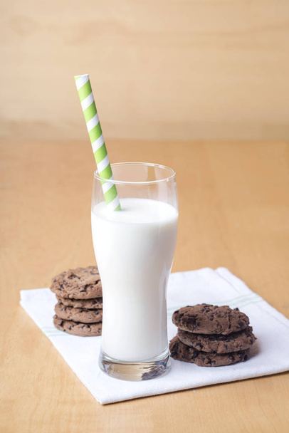 glass of milk and sweet chocolate chip cookies - Photo, Image