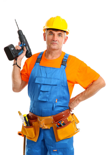 Male builder with drill in hand isolated on white close-up - Photo, image
