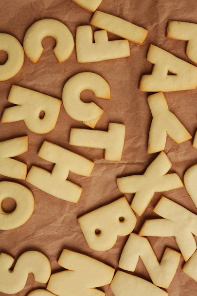 Cookie alphabet on paper - Foto, Imagen
