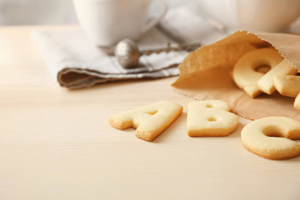 Cookie alphabet on kitchen table  - Photo, Image