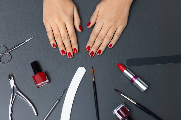 Beauty. Beautiful Female Nails With Red Nail Polish And Tools - Fotoğraf, Görsel