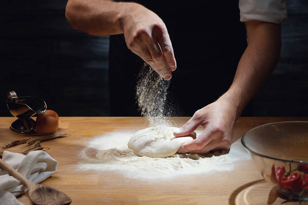 Male hands kneading dough - Fotografie, Obrázek
