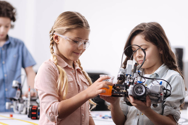 Inventive pupils conducting science experiment  - Valokuva, kuva