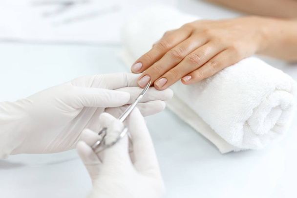 Nail Care. Female Hands Cutting Cuticles With Scissors. Manicure - Foto, Imagen