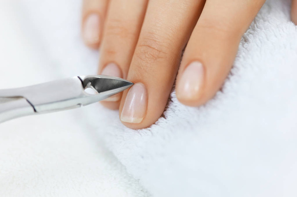 Nail Salon. Female Hand With Healthy Nails Getting Manicure - Фото, зображення