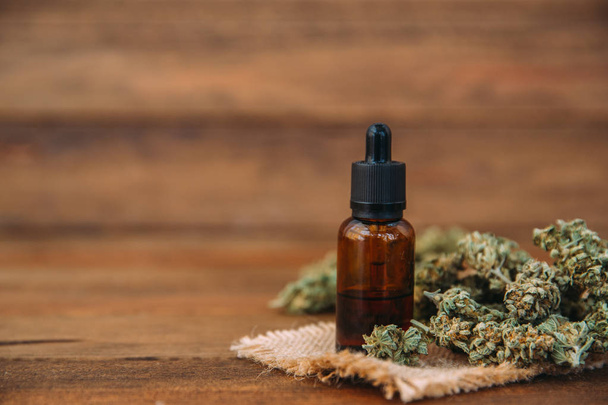 Medicinal cannabis with extracted oil in a bottle - Valokuva, kuva