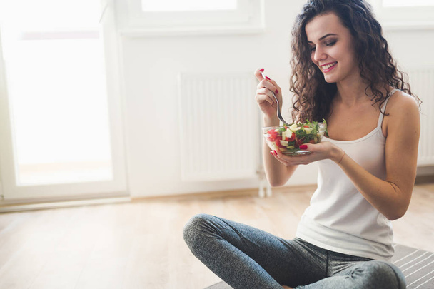 fit woman eating healthy salad - Photo, Image