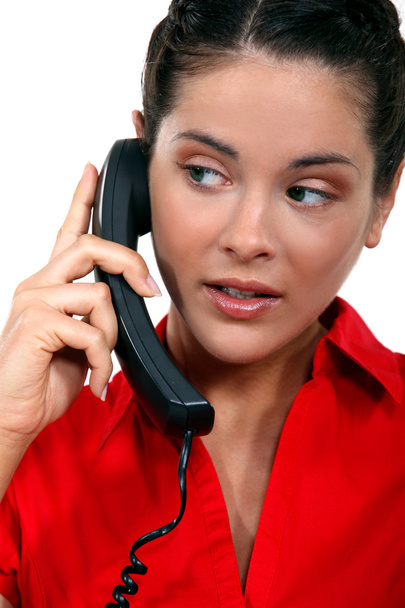 Young woman talking on the telephone - Фото, зображення