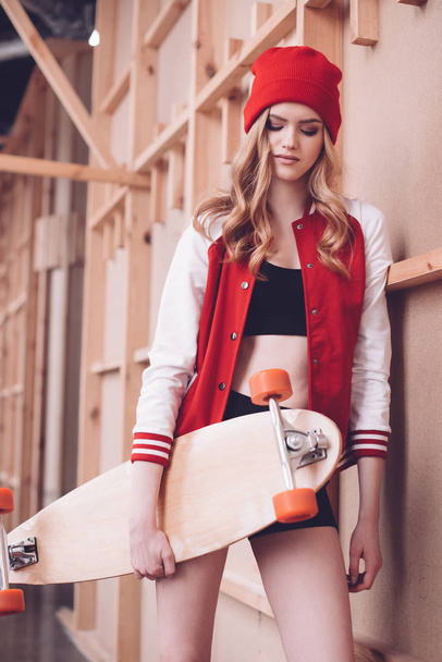 Hipster woman with longboard - Photo, Image