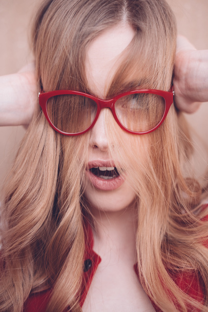 Stressed woman with eyeglasses - Фото, изображение