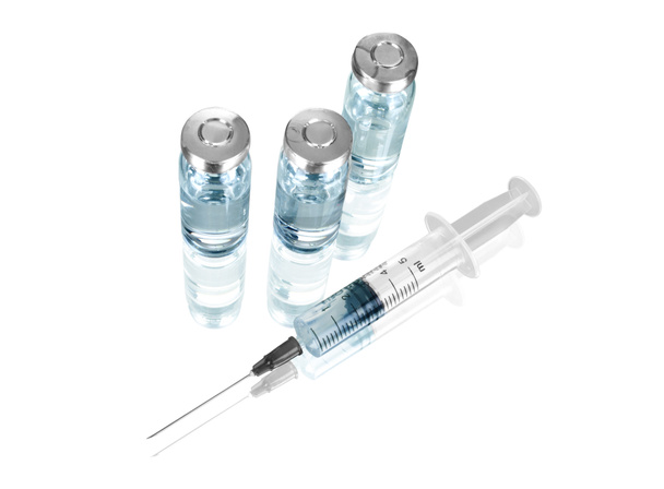 Medical ampoules and syringe isolated on white - Фото, изображение