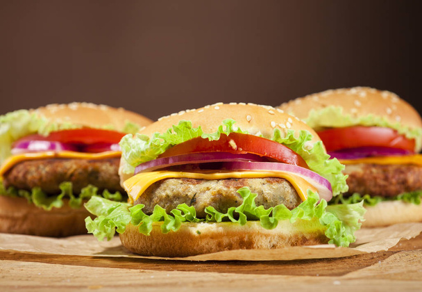 Fresh burgers on wooden background - Φωτογραφία, εικόνα
