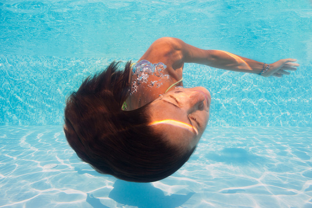 Underwater woman portrait in swimming pool. - Fotó, kép