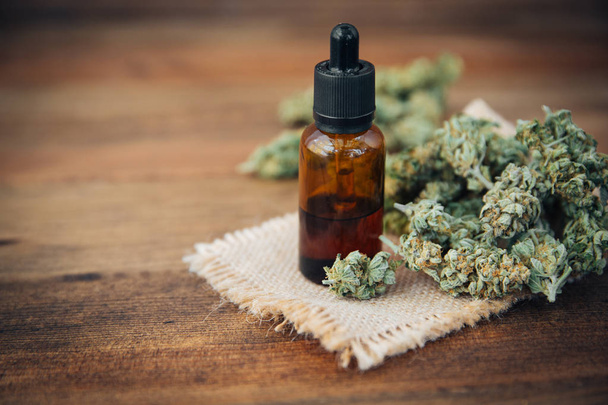 Medicinal cannabis with extracted oil in a bottle - Φωτογραφία, εικόνα