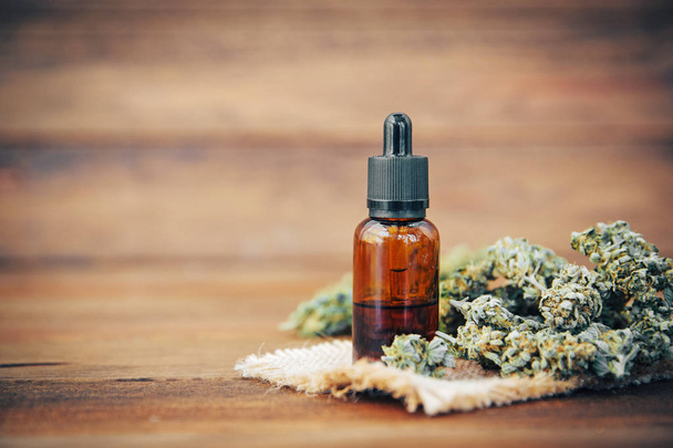 Medicinal cannabis with extracted oil in a bottle - 写真・画像