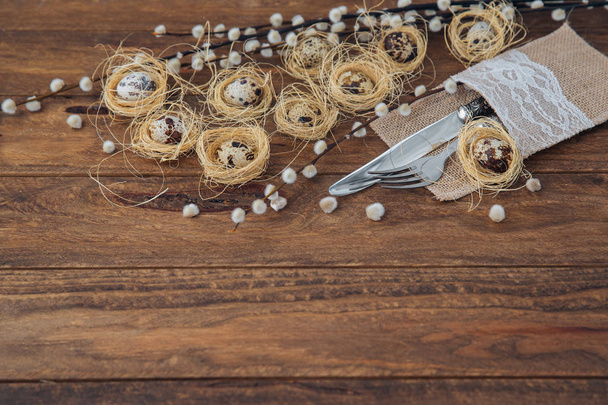 Quail eggs on wooden background. Easter composition  - Foto, afbeelding