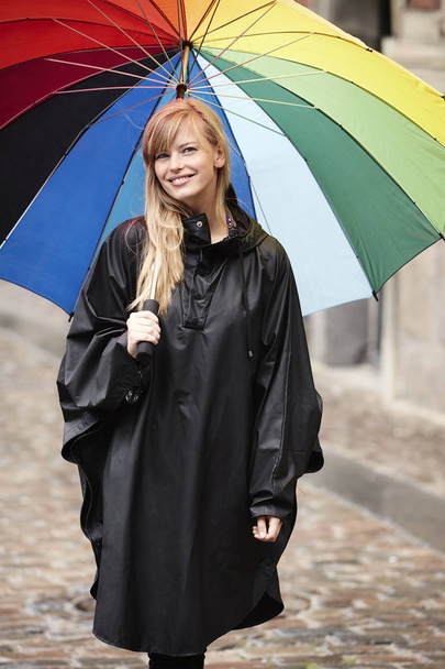 Beautiful woman under umbrella  - Foto, Imagen