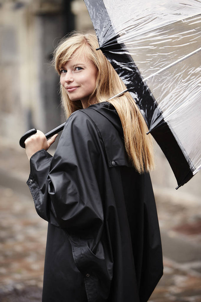 Blond woman with umbrella - Foto, afbeelding