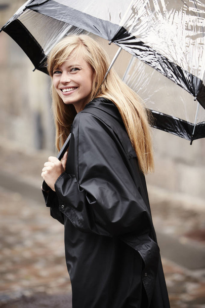 Blond woman under umbrella - Φωτογραφία, εικόνα