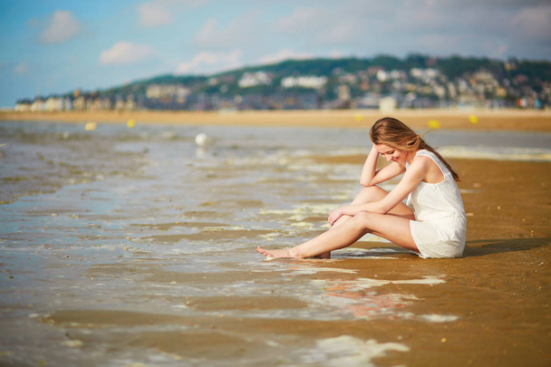 Woman enjoying her vacation by ocean or sea - Photo, Image