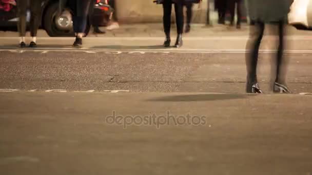 Low section of commuters crossing a road, London, England - Materiaali, video