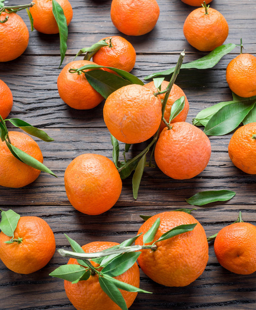Ripe tangerines on wooden table.  - Fotó, kép