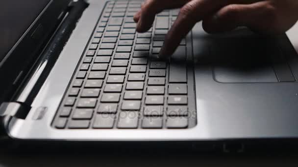 Close up of laptop keyboard. Mans hands typing text - Footage, Video