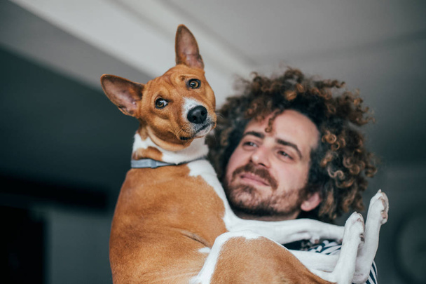 Man holding cute dog - Photo, Image