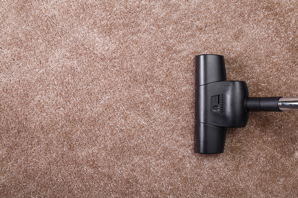 Vacuuming carpet with vacuum cleaner. Housework. - Φωτογραφία, εικόνα