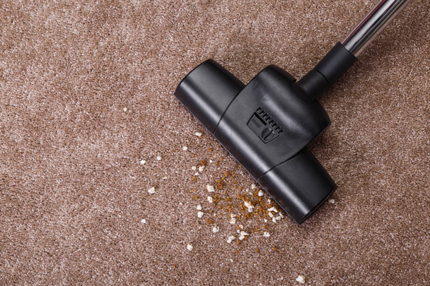 Vacuuming carpet with vacuum cleaner. Housework. - Foto, imagen