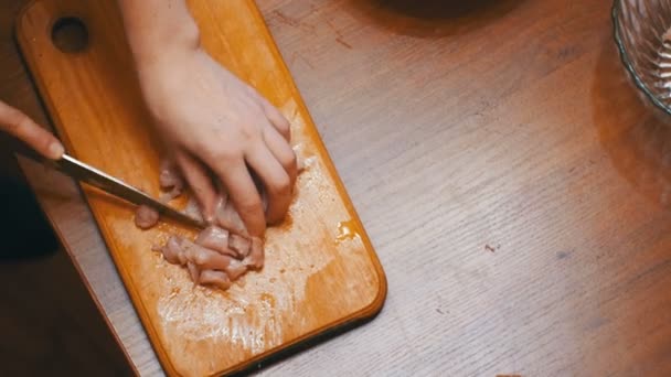 Hands Cutting Fresh Meat, Cutting Meat on a Kitchen Board, Cutting Raw Meat - Video, Çekim
