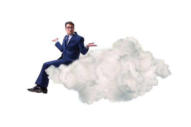 Empresario sentado en la nube en concepto de motivación - Foto, imagen