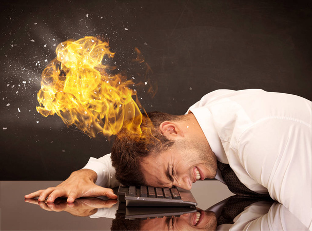 Stressed business man's head is burning - Fotoğraf, Görsel