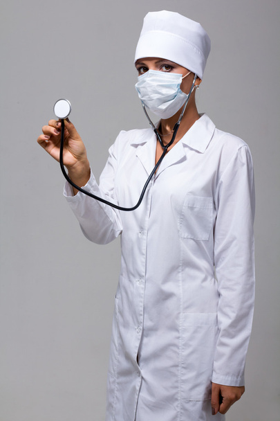 Portrait of young doctor or medic with stethoscope - Foto, Bild