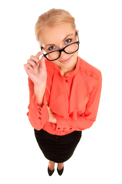 Young woman looking at you over glasses - Photo, image
