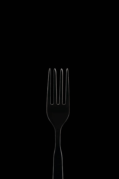 White contour fork on black background - Фото, изображение