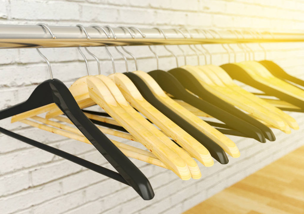 Clothes hangers hanging on metal rack, selective focus, 3D rendering - Photo, Image