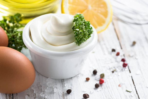 Mayonnaise sauce and ingredients on white - Photo, Image