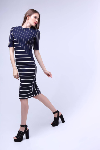 elegant woman in striped dress - Foto, Bild
