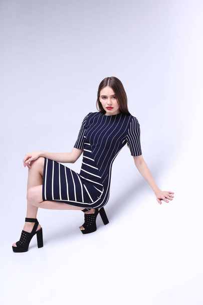 young woman in striped dress - 写真・画像