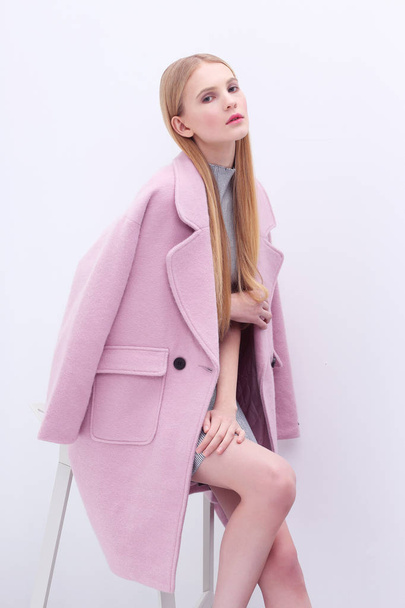Blond woman in pink coat - Valokuva, kuva