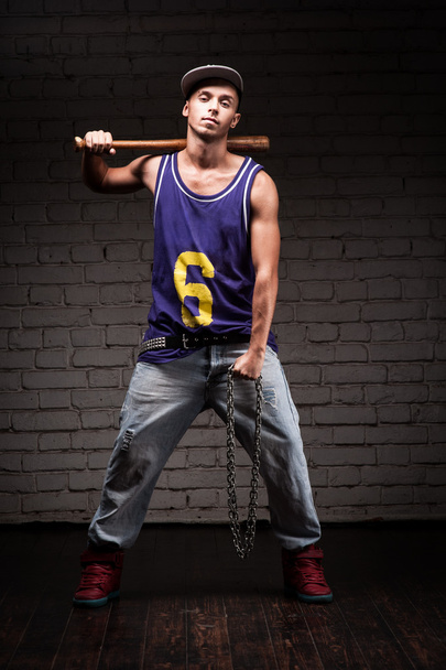 Hip-hop style man holding baseball bat and chain - Fotografie, Obrázek