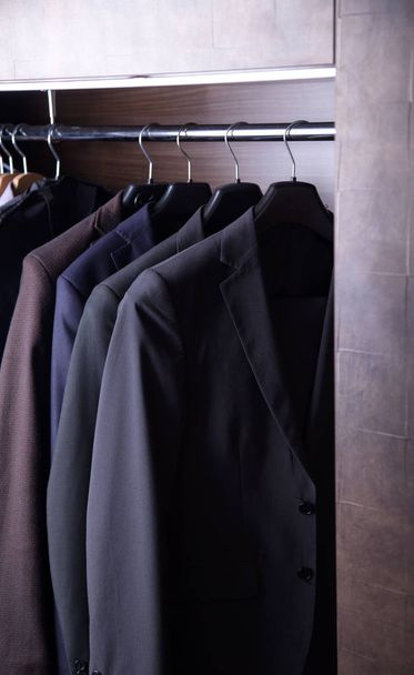 Row of men's suits hanging - Photo, Image