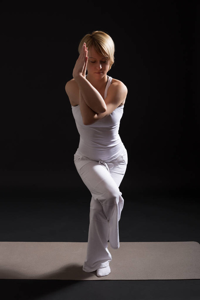 Woman practicing yoga - Φωτογραφία, εικόνα